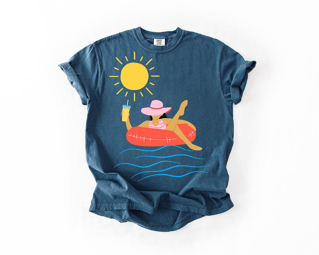 Sunfloat Pool Party T-Shirt — Woman on Inflatable with Drink  Comfort Colors 1717
